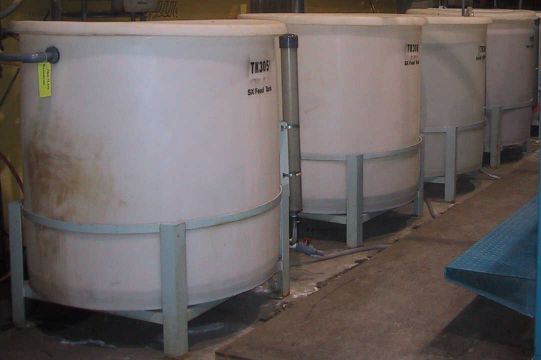 SX feed, scrub solution, and strip solution feed tanks for a solvent extraction pilot plant.