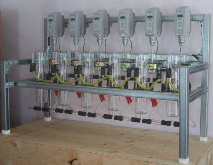 Laboratory or bench scale solvent extraction pilot plant with 6 mixer-settlers.