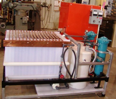 Electrowinning pilot plant with 1000 amp rectifier and cell having 8 cathodes and 9 anodes.