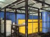 Copper solvent extraction pilot plant showing yellow organic tank
